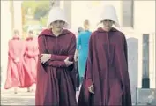  ?? George Kraychyk Hulu ?? HANDMAIDS Offred (Elisabeth Moss), left, Ofglen (Alexis Bledel) in “The Handmaid’s Tale” on Hulu.