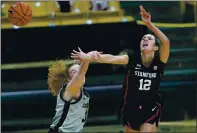  ?? DAVID ZALUBOWSKI — THE ASSOCIATED PRESS ?? Stanford guard Lexie Hull, right, is fouled by Colorado guard Frida Formann during overtime of Sunday’s game in Boulder.