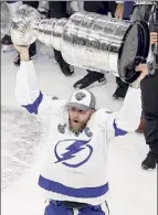  ?? Bruce Bennett / Getty ?? Captain Steven Stamkos of the Lightning skates with the Stanley Cup after Game 6 on Monday night.