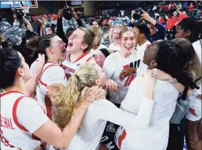  ?? Matt Rourke / Associated Press ?? Fairfield players celebrates after defeating Manhattan in the MAAC title game on Saturday in Atlantic City, N.J.