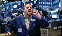  ?? DREW ANGERER / GETTY IMAGES ?? In December, waves of panic-driven selling left the S&amp;P 500 dangling almost 20 percent below its high. Now it’s all being taken in stride.