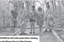  ??  ?? Author (far left) with monks before climbing up the Phnom Chisor in Takeo Province.