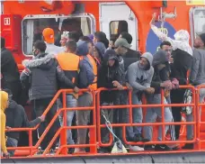  ?? EPA ?? A boat delivers migrants to Arguinegui­n on Gran Canaria after they were taken from the sea by rescuers