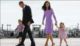  ?? CHRISTIAN CHARISIUS / POOL PHOTO VIA AP ?? Prince William and his wife, Kate, the Duchess of Cambridge, and their children, Prince George (left) and Princess Charlotte, board a plane in Hamburg, Germany, in July. Kate’s due date is between mid-March and mid-June.