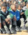  ??  ?? MILES OF SMILES: Some of the pupils from Coega Primary who received more than 400 pairs of school shoes