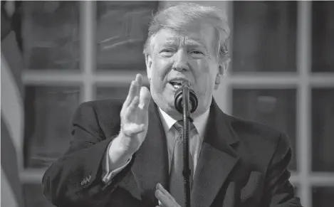  ?? EVAN VUCCIV AP ?? U.S. President Donald Trump speaks during an event in the Rose Garden at the White House to declare a national emergency in order to build a wall along the southern border, on Friday in Washington. •