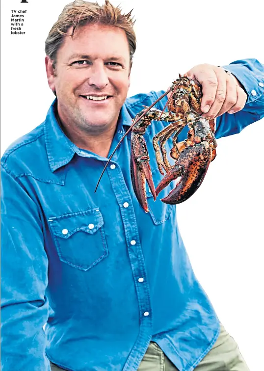  ??  ?? TV chef James Martin with a fresh lobster