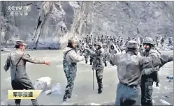  ??  ?? In a video released by China's CCTV on Friday, Indian and Chinese soldiers are seen engaged in a clash in Galwan Valley on June 15, 2020.