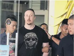  ?? WASSAYOS NGAMKHAM ?? Matthew Dupre, an alleged Canadian contract killer, is detained at the Crime Suppressio­n Division yesterday.