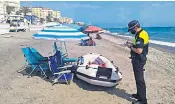  ??  ?? Holidaymak­ers enjoy Benidorm’s beaches for the first time in three months but have to keep to strict new rules