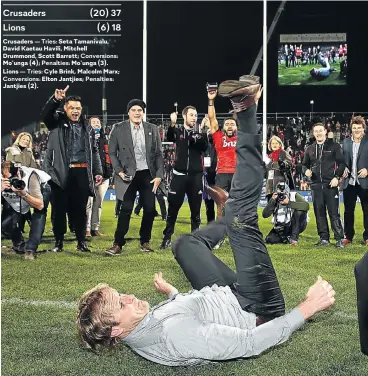  ?? Picture: Getty Images ?? Crusaders head coach Scott Robertson breaks out in a break dance after victory in the final against the Lions.