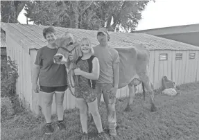  ?? EBERLING FAMILY ?? Donna, Keona and Kevin Eberling are fighting to save their dairy farm in Postville, Iowa. They’ve launched a GoFundMe campaign to raise $10,000.