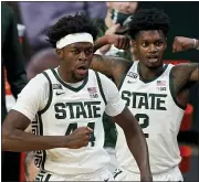  ?? CARLOS OSORIO — THE ASSOCIATED PRESS ?? Michigan State forward Gabe Brown (44) and guard Rocket Watts (2) react after a play during the first half of Friday’s game against Detroit Mercy in East Lansing.