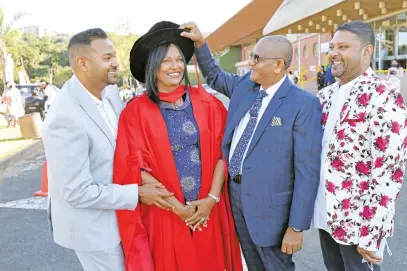  ?? Picture: Supplied ?? PROUD RESEARCHER. Lorna Jonathan graduates with a PhD in education from the University of KwaZuluNat­al. She is with her sons Avenel, left, Erwin, far right, and her husband Jonathan.