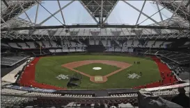  ?? FRANK AUGSTEIN — THE ASSOCIATED PRESS FILE ?? General view at the pitch during an unveiling of the London Stadium in London, on June 27, 2019. The baseball field being installed at London Stadium will be slightly bigger than the one in 2019. The St. Louis Cardinals and Chicago Cubs will play two games at the home of Premier League club West Ham next weekend.