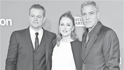  ?? KEVIN WINTER, GETTY IMAGES ?? George Clooney, right, at the Suburbicon premiere with Matt Damon and Julianne Moore, said he hopes “this is a watershed moment ... where men who are committing these crimes, these violations, don’t feel safe.”