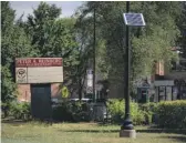  ?? PAT NABONG/SUN-TIMES PHOTOS ?? A device that enables people to connect to the internet is mounted to a pole at Peter A. Reinberg Elementary on Tuesday.