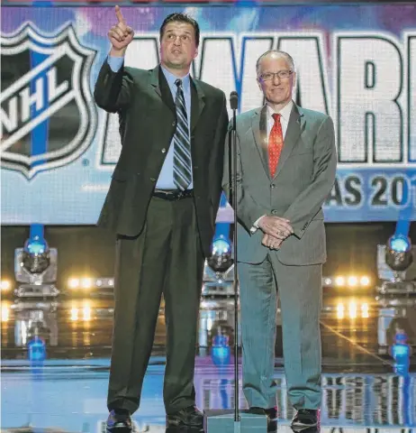  ?? | ETHANMILLE­R/ GETTY IMAGES ?? Eddie Olczyk, shown during the 2014 NHL Awards with broadcaste­r Doc Emrick, has called only 17 games this season.
