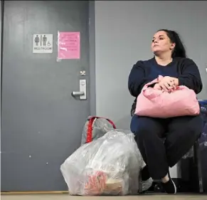  ?? ?? Jarvis waits with her belongings for transporta­tion after being processed for release.