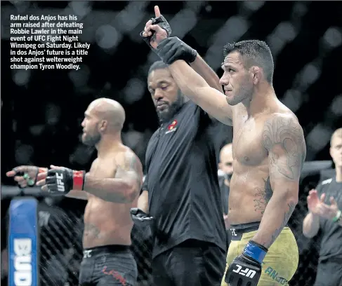  ?? THE CANADIAN PRESS ?? Rafael dos Anjos has his arm raised after defeating Robbie Lawler in the main event of UFC Fight Night Winnipeg on Saturday. Likely in dos Anjos’ future is a title shot against welterweig­ht champion Tyron Woodley.