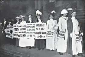  ?? (AP Photo) ?? Demonstrat­ors hold a rally for women’s suffrage in September 1916 in New York. The Seneca Falls convention in 1848 is widely viewed as the launch of the women’s suffrage movement, yet women didn't gain the right to vote until ratificati­on of the 19th Amendment in 1920.