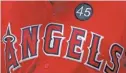  ?? TOM PENNINGTON/GETTY IMAGES ?? Angels players’ jerseys now bear a patch with Skaggs’ No. 45. The pitcher died Monday at 27.