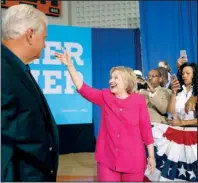  ?? AP/CAROLYN KASTER ?? Rep. Robert Brady, D-Pa., accompanie­s Hillary Clinton at a Democratic Party voter-registrati­on event Tuesday at West Philadelph­ia High School.