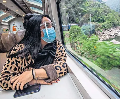  ?? ?? Double whammy: in Peru you will have to wear two masks in some situations, such as on a train journey