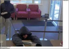  ?? SUBMITTED PHOTO ?? This surveillan­ce photo shows suspects in the robbery of a Wells Fargo Bank in Ridley Park on Monday.