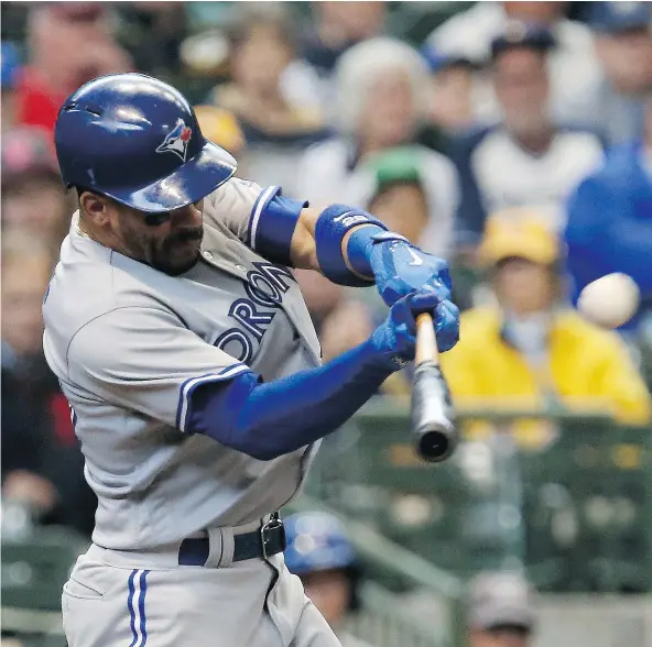  ?? — GETTY IMAGES FILES ?? Toronto Blue Jays second baseman Devon Travis, seen hitting a home run in the sixth inning against the Milwaukee Brewers on Wednesday in Milwaukee, has been on an offensive tear of late, clubbing 14 doubles in his last 20 games.