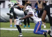  ?? AP PHOTO ?? Oakland Raiders strong safety Nate Allen, left, intercepts a pass in front of Buffalo Bills wide receiver Marquise Goodwin.