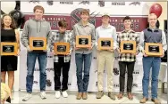  ?? ?? The 2022 Siloam Springs cross country seniors with special keepsake boxes: Anna Floyd, Wilson Cunningham, Anthony Cruz, Levi Fox, Riley Harrison, Billy Samoff and Rustin Shirley. Not pictured is Barrett Eldridge.