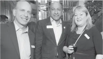  ??  ?? Mark Breslauer from Monk Office, left, joins Al Hasham of Maximum Express and Tammy Averill from Country Grocer.