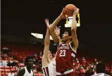  ?? Young Kwak / Associated Press ?? Stanford forward Brandon Angel, who finished with 16 points, shoots over Washington State forward Andrej Jakimovski.