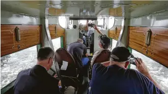  ?? Melissa Phillip / Houston Chronicle ?? Passengers enjoy the view during a flight on the Experiment­al Aircraft Associatio­n's 1929 Ford Tri-Motor this week. The EAA is selling tickets to the public for short flights at West Houston Airport through Sunday.