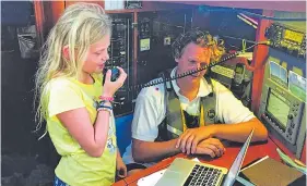  ??  ?? TUNED IN: Under her dad’s watchful eye, Bluebell runs the ship’s radio