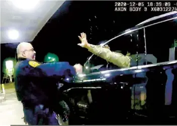  ?? AP ?? In this still image from police video, a police officer is seen using a spray agent on U.S. Army 2nd Lt. Caron Nazario during a traffic stop on Dec. 20, 2020, in Windsor, Va.