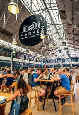  ??  ?? From left to right: Portugal’s beloved
pastel de nata is an all-day sweet snack; a serving of grilled sardines; the Time Out Market is a modern food hall at the Mercado da Ribeira.