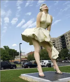  ?? MATTHEW BROWN — HEARST CONNECTICU­T MEDIA VIA AP ?? This Thursday photo shows Seward Johnson’s “Forever Marilyn” sculpture in Latham Park in Stamford, Conn. The 26-foot statue that was newly installed in the park is scandalizi­ng some because her rear end is facing the entrance of the First...