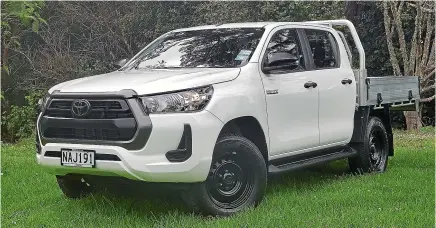 ?? DAMIEN O’CARROLL/STUFF ?? No exterior frills and a good, honest flat deck. The Hilux SR cab chassis is all business.
