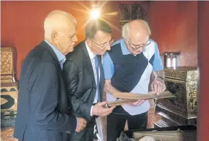  ??  ?? LEFT
German Prof Harald Hundius shows German Ambassador Peter Prügel and Hagen E.W. Dirksen, honorary consul of the Federal Republic of Germany, Chiang Mai, the preserved Lanna manuscript­s at Wat Duang Dee.