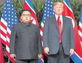  ?? EVAN VUCCI — THE ASSOCIATED PRESS ?? U.S. President Donald Trump tweeted that the deal he reached with North Korean leader Kim Jong Un, left, means there is no longer a nuclear threat from North Korea.