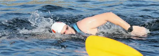  ?? RICK KENT/ULTRAMAN CANADA ?? Michael Brown during 10-kilometre swim on first day of Ultraman Canada competitio­n in Penticton.