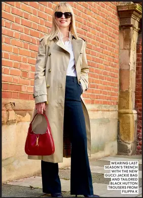  ?? ?? WEARING LAST SEASON’S TRENCH WITH THE NEW GUCCI JACKIE BAG AND TAILORED BLACK HUTTON TROUSERS FROM FILIPPA K