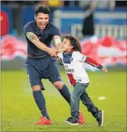  ?? GETTY IMAGES ?? Brazil captain Thiago Silva, seen here with his son, is one of many from his country to star in European clubs.