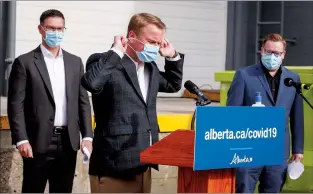  ?? CP PHOTO JEFF MCINTOSH ?? Minister of Health Tyler Shandro removes his mask before speaking to the media in Calgary on Oct. 7.