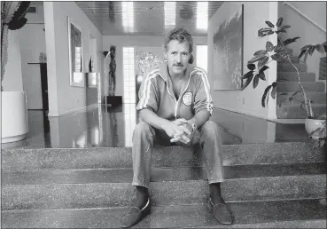  ?? ALAN GRETH — THE ASSOCIATED PRESS ?? Game show host Alex Trebek poses for a photo in his Los Angeles home on Aug. 3, 1988. Trebek, who presided over the beloved quiz show “Jeopardy!” for more than 30 years with dapper charm and a touch of school-master strictness, died Nov. 8. He was 80.