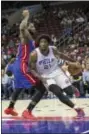  ?? CHRIS SZAGOLA — THE ASSOCIATED PRESS ?? Philadelph­ia 76ers’ Joel Embiid drives to the basket against Detroit Pistons’ Andre Drummond during a preseason game last Saturday in Philadelph­ia.