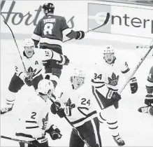  ?? TREVOR HAGAN THE CANADIAN PRESS ?? The Toronto Maple Leafs’ Patrick Marleau, left, Ron Hainsey, Kasperi Kapanen and Auston Matthews celebrate Kapanen’s goal in Winnipeg.