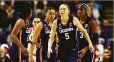  ?? Elsa / Getty Images ?? UConn’s Paige Bueckers (5) after a play against NC State in an Elite Eight game March 28 in Bridgeport. Bueckers says not to count the Huskies out, despite her ACL injury.